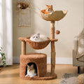 Three cats in a cat tree with hammocks in a room.